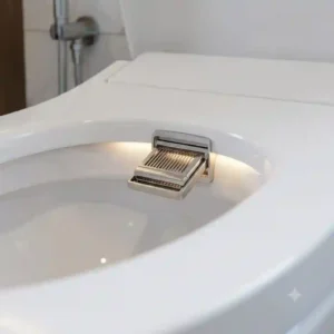 Close-up view of the built-in warm air dryer mechanism on an electric bidet toilet with dryer.